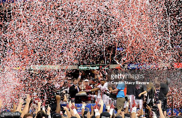 Head coach Bob Stoops of the Oklahoma Sooners stands with the trophy after defeating the Alabama Crimson Tide 45-31 in the Allstate Sugar Bowl at the...