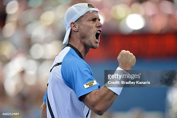 Lleyton Hewitt of Australia celebrates after winning a break point in his match against Marius Copil of Romania during day six of the 2014 Brisbane...