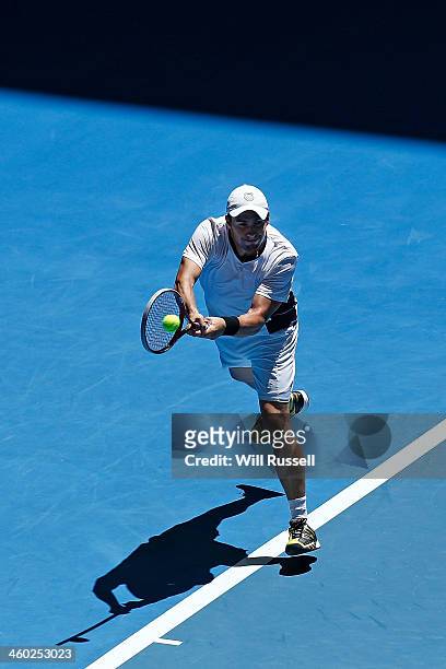 Daniel Munoz-De La Nava of Spain plays a backhand in the men's singles match against Jo-Wilfried Tsonga of France during day seven of the Hopman Cup...