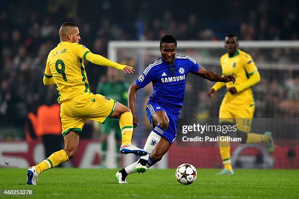 Mikel John Obi of Chelsea is tackled by Islam Slimani of Sporting Lisbon during the UEFA Champions League group G match between Chelsea and Sporting...