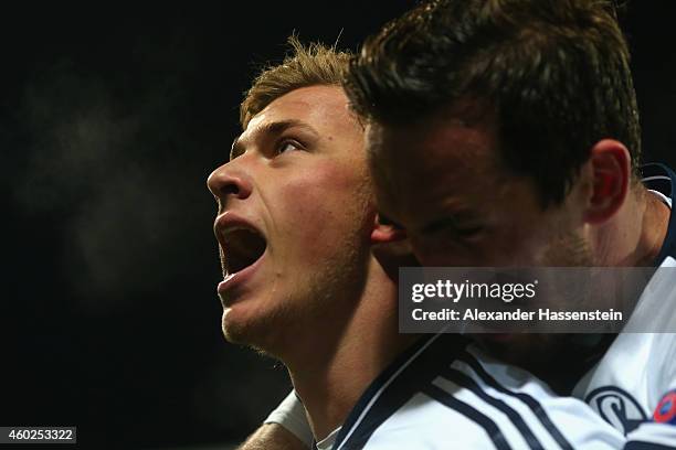 Max Meyer of Schalke celebrates scoring the opening goal with his team mate Christian Fuchs during the UEFA Group G Champions League match between NK...