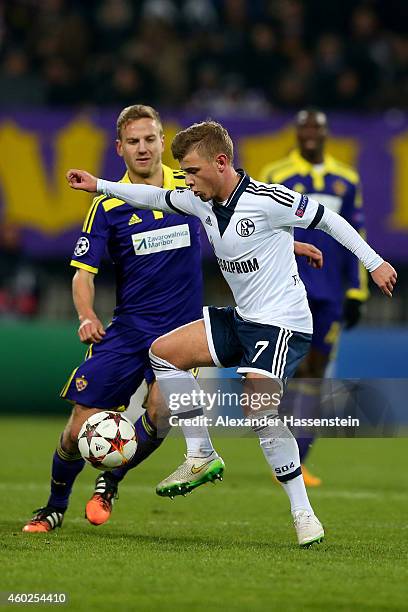 Max Meyer of Schalke battles for the ball with Ales Mertelj of Maribor during the UEFA Group G Champions League match between NK Maribor and FC...