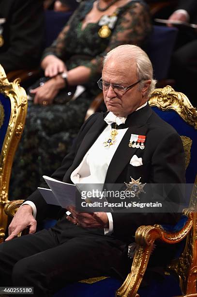 King Carl XVI Gustaf of Sweden attends the Nobel Prize Banquet after the 2014 Nobel Prize Awards Ceremony at Concert Hall on December 10, 2014 in...