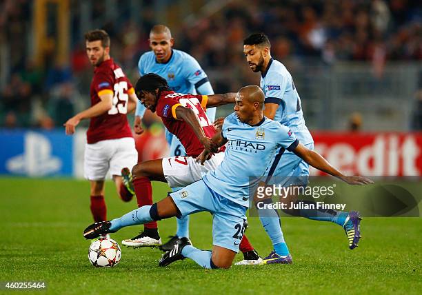 Fernandinho of Manchester City tackles Gervinho of AS Roma during the UEFA Champions League Group E match between AS Roma and Manchester City FC at...