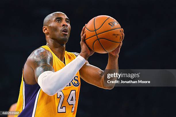 Kobe Bryant of the Los Angeles Lakers shoots a free throw during a game against the Sacramento Kings at Staples Center on December 9, 2014 in Los...