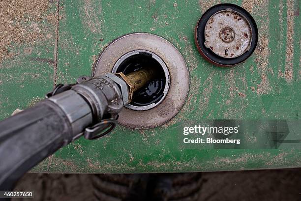 John Deere & Co. Tractor is filled with diesel fuel in Manlius, Illinois, U.S., on Wednesday, Dec. 10, 2014. Gasoline supplies rose 8.2 million...