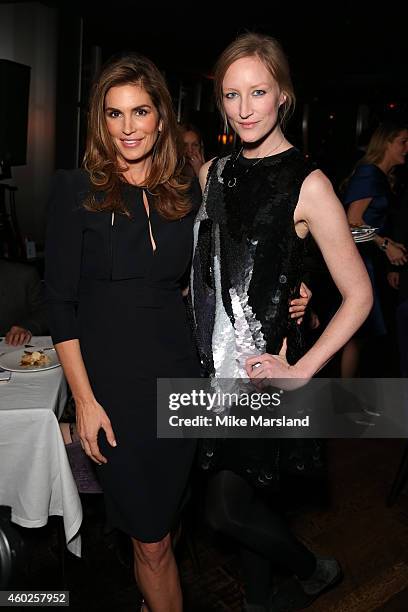 Model Cindy Crawford and Jade Parfitt pose at the Omega Oxford Street Store Opening Party at The Shard on December 10, 2014 in London, England.