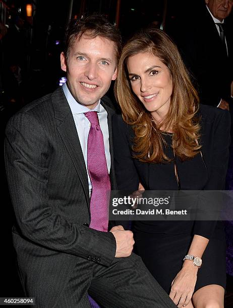 James Blunt and Cindy Crawford attend a private dinner celebrating the opening of the OMEGA Oxford Street boutique at Aqua Shard on December 10, 2014...
