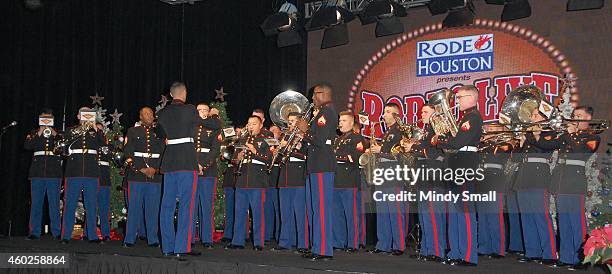 The 3rd Marine Aircraft Wing Band conducted by Staff Sgt. Mark Pellon performs during the NFR Cowboy Fanfest 2014 at the Las Vegas Convention Center...