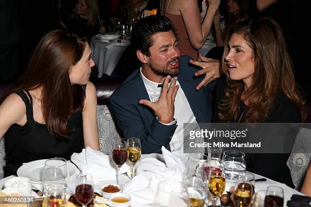 Actors Claire Forlani, Dominic Cooper and model Cindy Crawford attend the Omega Oxford Street Store Opening Party at The Shard on December 10, 2014...