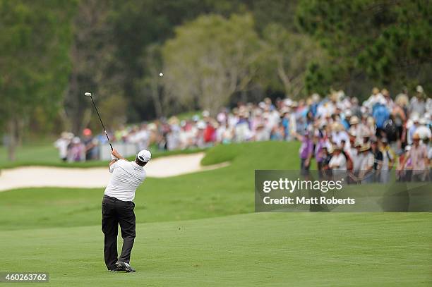 Boo Weekley of the United States plays his approach shot on the 9th hole during day one of the 2014 Australian PGA Championship at Royal Pines Resort...