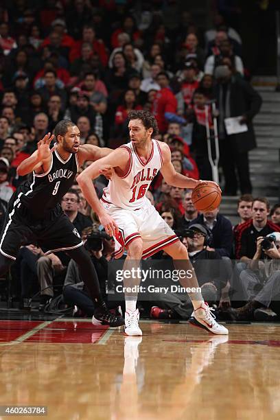 Pau Gasol of the Chicago Bulls handles the ball against Jerome Jordan of the Brooklyn Nets on December 10, 2014 at the United Center in Chicago,...