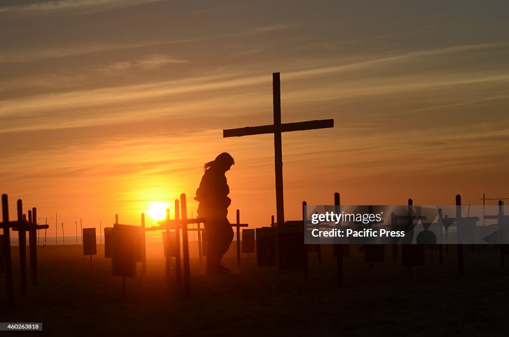 On the sands of Copacabana beach, 152 black crosses were...