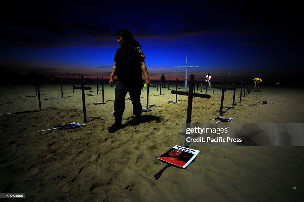 On the sands of Copacabana beach, 152 black crosses were...