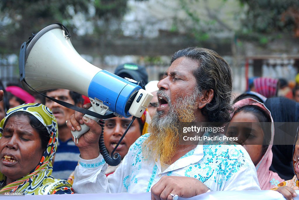 Slum people protest in front of the Dhaka Press Club during...