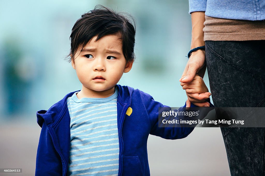 Toddler girl with a serious looking face