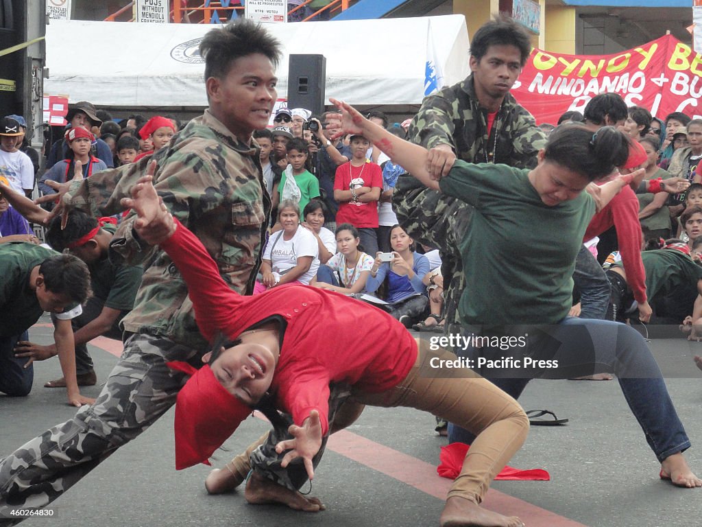 Protesters from Southern Tagalog region perform a skit...