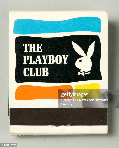 Stick matchbook with glossy white exterior, 1954. Front cover with black and white image of high rise at night and orange lettering, NEW YORK. Rear...