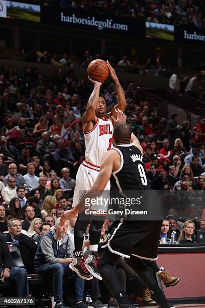 Derrick Rose of the Chicago Bulls shoots against Jerome Jordan of the Brooklyn Nets on December 10, 2014 at the United Center in Chicago, Illinois....