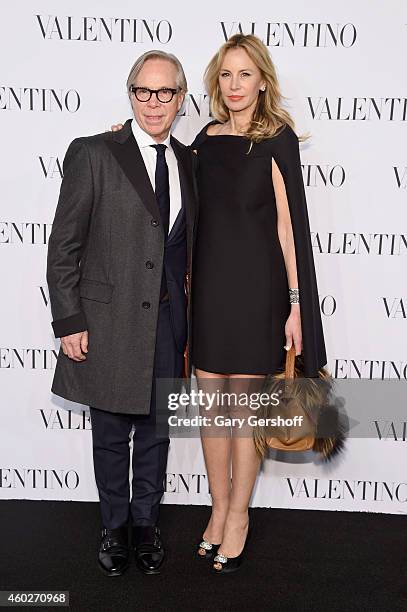 Designer Tommy Hilfiger and Dee Ocleppo attend the Valentino Sala Bianca 945 Event on December 10, 2014 in New York City.