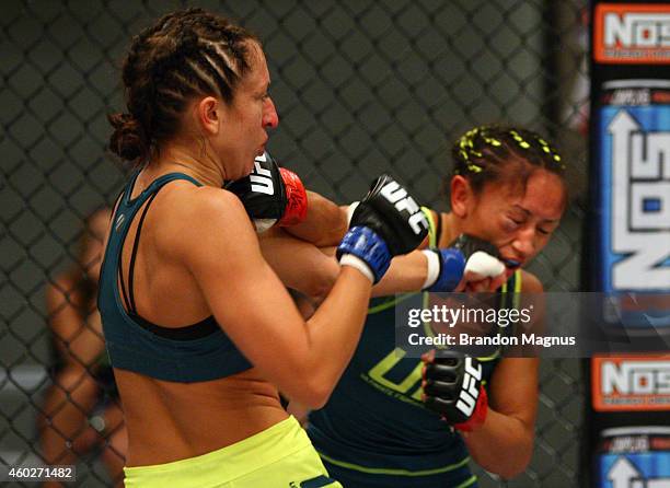 Team Pettis fighter Jessica Penne exchanges punches with team Pettis fighter Carla Esparza during filming of season twenty of The Ultimate Fighter on...