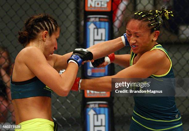 Team Pettis fighter Jessica Penne punches team Pettis fighter Carla Esparza during filming of season twenty of The Ultimate Fighter on August 14,...