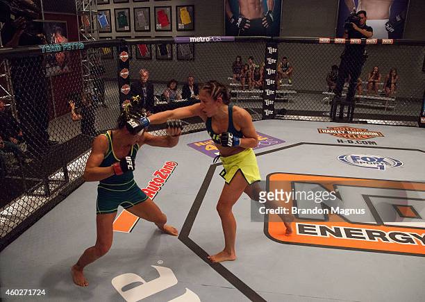 Team Pettis fighter Jessica Penne punches team Pettis fighter Carla Esparza during filming of season twenty of The Ultimate Fighter on August 14,...