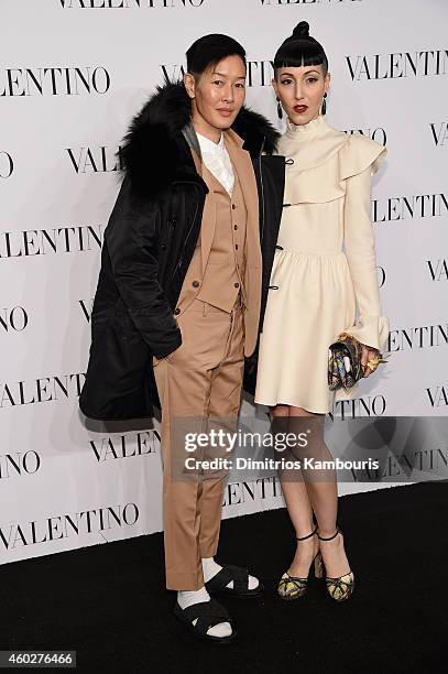 Jenny Shimizu and Michelle Harper attend the Valentino Sala Bianca 945 Event on December 10, 2014 in New York City.