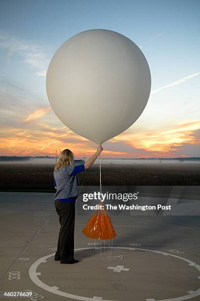 Meteorologist, Carrie Suffern Prepares to Release the Weather Balloon at National Weather Service Headquarters on October 1, 2012 in Sterling Virginia