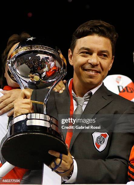 Marcelo Gallardo, coach of River Plate celebrates with the trophy after winning the second leg final match between River Plate and Atletico Nacional...