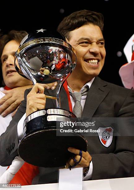 Marcelo Gallardo, coach of River Plate celebrates with the trophy after winning the second leg final match between River Plate and Atletico Nacional...