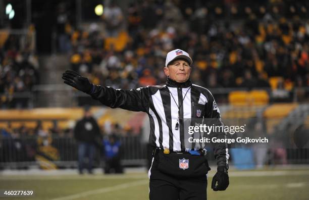 National Football League referee Ed Hochuli signals during a game between the Cincinnati Bengals and Pittsburgh Steelers at Heinz Field on December...