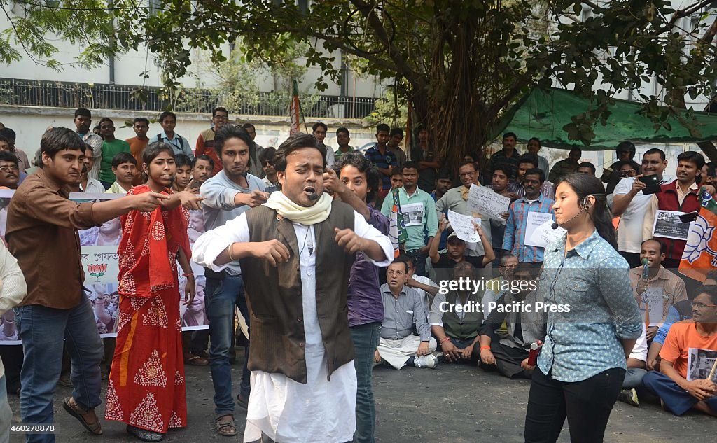 Activists participate in a mock drama on Sardha Chit Fund...