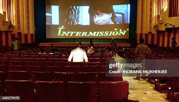 India-entertainment-Bollywood-cinema,FOCUS by Aditya PHATAK In this photograph taken on December 5 Indian cinemagoers leave their seats as an...