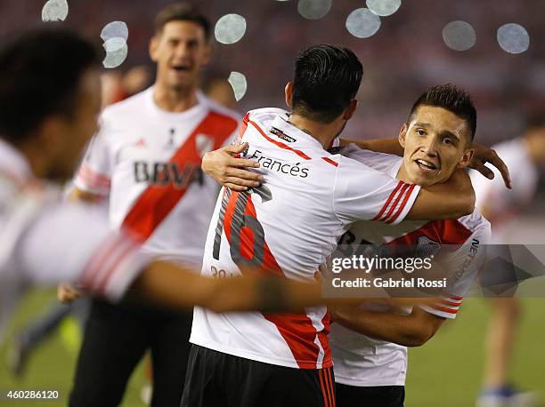 Matias Kranevitter and Ariel Rojas of River Plate celebrate after winning the second leg final match between River Plate and Atletico Nacional as...