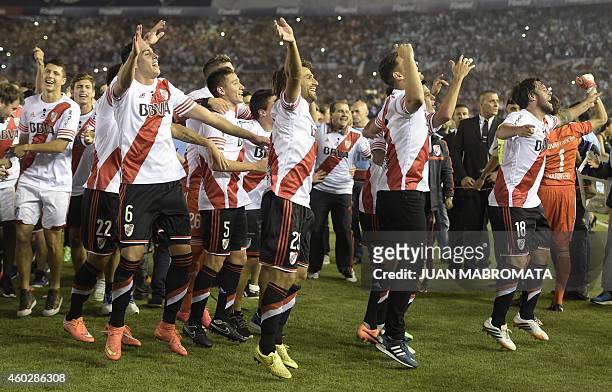 Players from Argentina's River Plate side celebrate after winning the 2014 Copa Sudamericana by defeating Colombia's Atletico Nacional in the second...