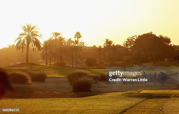 Players walk down the 10th fairway as they start the second round of the Omega Dubai Ladies Masters on the Majlis Course at the Emirates Golf Club on...