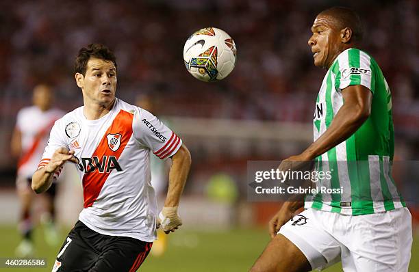 Rodrigo Mora of River Plate fights for the ball with Alexis Henriquez of Atletico Nacional during a second leg final match between River Plate and...