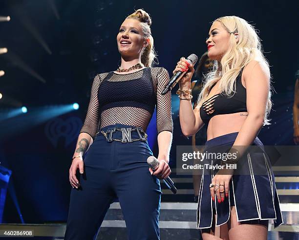 Iggy Azalea and Rita Ora perform "Black Widow" during Q102's Jingle Ball on December 10, 2014 in Philadelphia, Pennsylvania.