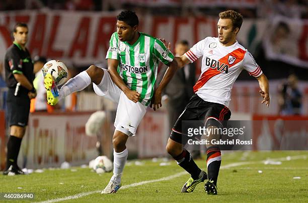 Luis Ruiz of Atletico Nacional fights for the ball with German Pezzella of River Plate during a second leg final match between River Plate and...