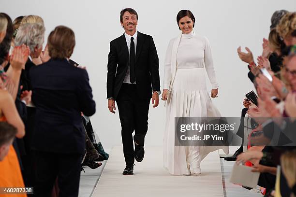 Valentino Creative Directors, Pierpaolo Piccioli and Maria Grazia Chiuri walk the runway during the Valentino Sala Bianca 945 Event on December 10,...