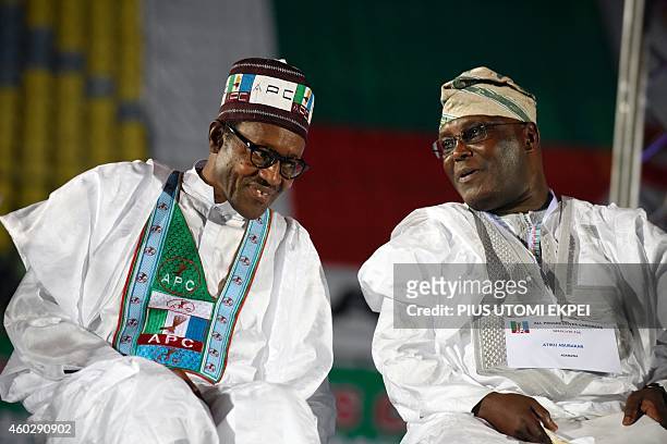Former military ruler and presidential aspirant of the opposition All Progressives Congress Muhammadu Buhari discusses with closest rival and former...
