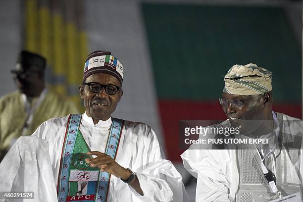 Former military ruler and presidential aspirant of the opposition All Progressives Congress Muhammadu Buhari reacts as he discusses with closest...