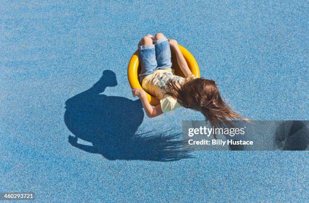 young girl playing alone in a park - children only stock pictures, royalty-free photos & images