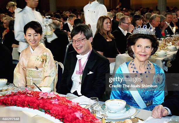 Professor Hiroshi Amano and Queen Silvia of Sweden attend the Nobel Prize Banquet 2014 at City Hall on December 10, 2014 in Stockholm, Sweden.