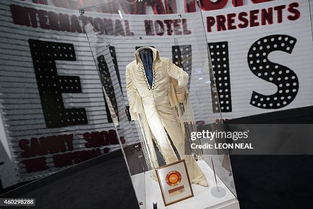 Singer Elvis Presley's webbed fringe jumpsuit is displayed during a photocall for the "Elvis at the O2" exhibition in London on December 11, 2014....