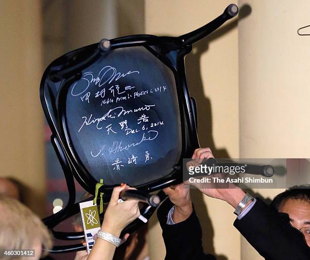 Signatures of Nobel Prize in Physics laureate Isamu Akasaki, Hiroshi Amano and Shuji Nakamura are seen at a back of a chair at Nobel Museum on...