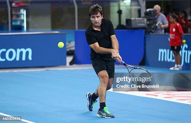 Fabrice Santoro of the Indian Aces in action against Patrick Rafter of the Singapore Slammers during the Coca-Cola International Premier Tennis...