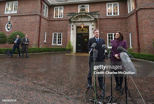 Prime Minister David Cameron alongside Northern Ireland Secretary of State Theresa Villiers talk to the gathered media as they arrive for cross party...