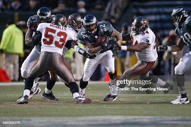 Duce Staley of the Philadelphia Eagles runs with the ball during a game against the Tampa Bay Buccaneers on January 19, 2003 at Veteran's Stadium in...